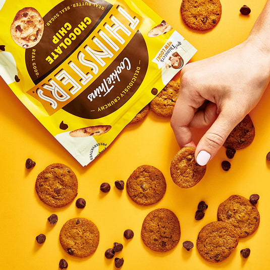 Hand holding Thinsters Bite Size Cookies Chocolate Chip