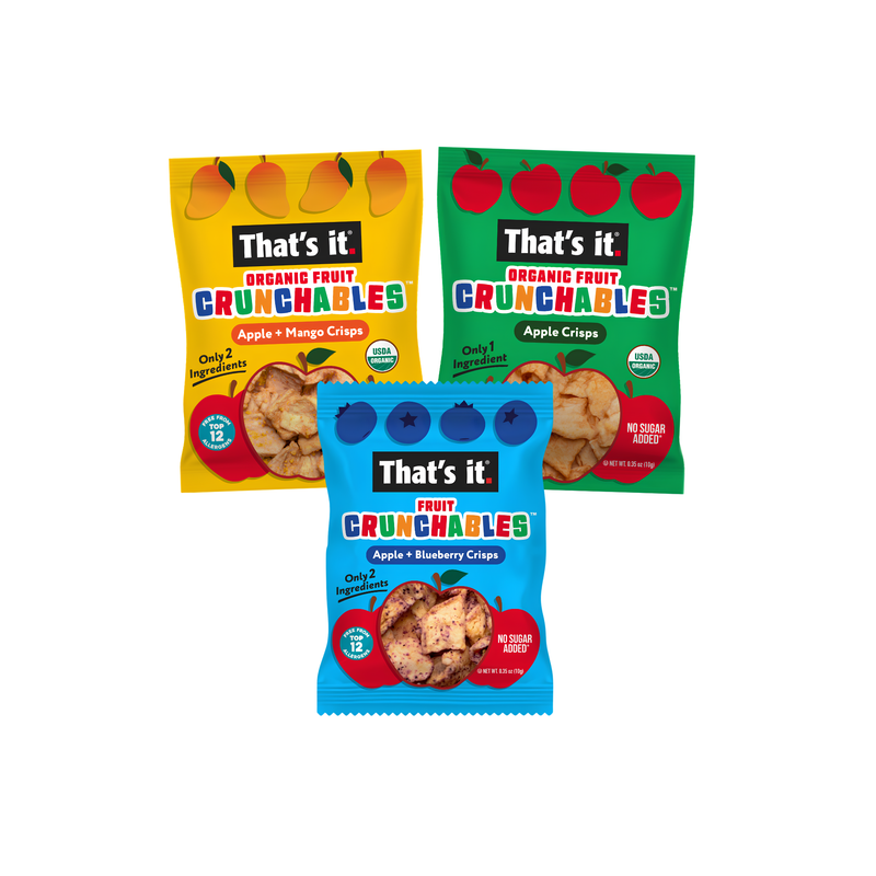 Load image into Gallery viewer, Three bags of That's it! Fruit Crunchables organic fruit chips arranged on a white background. The front bag is blue and contains Apple + Blueberry Crisps, while the two bags behind it are yellow and green, containing Apple + Mango Crisps and Apple + Cranberry Crisps respectively.
